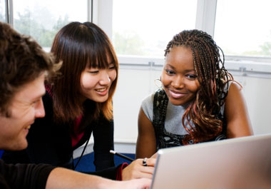 students with laptop